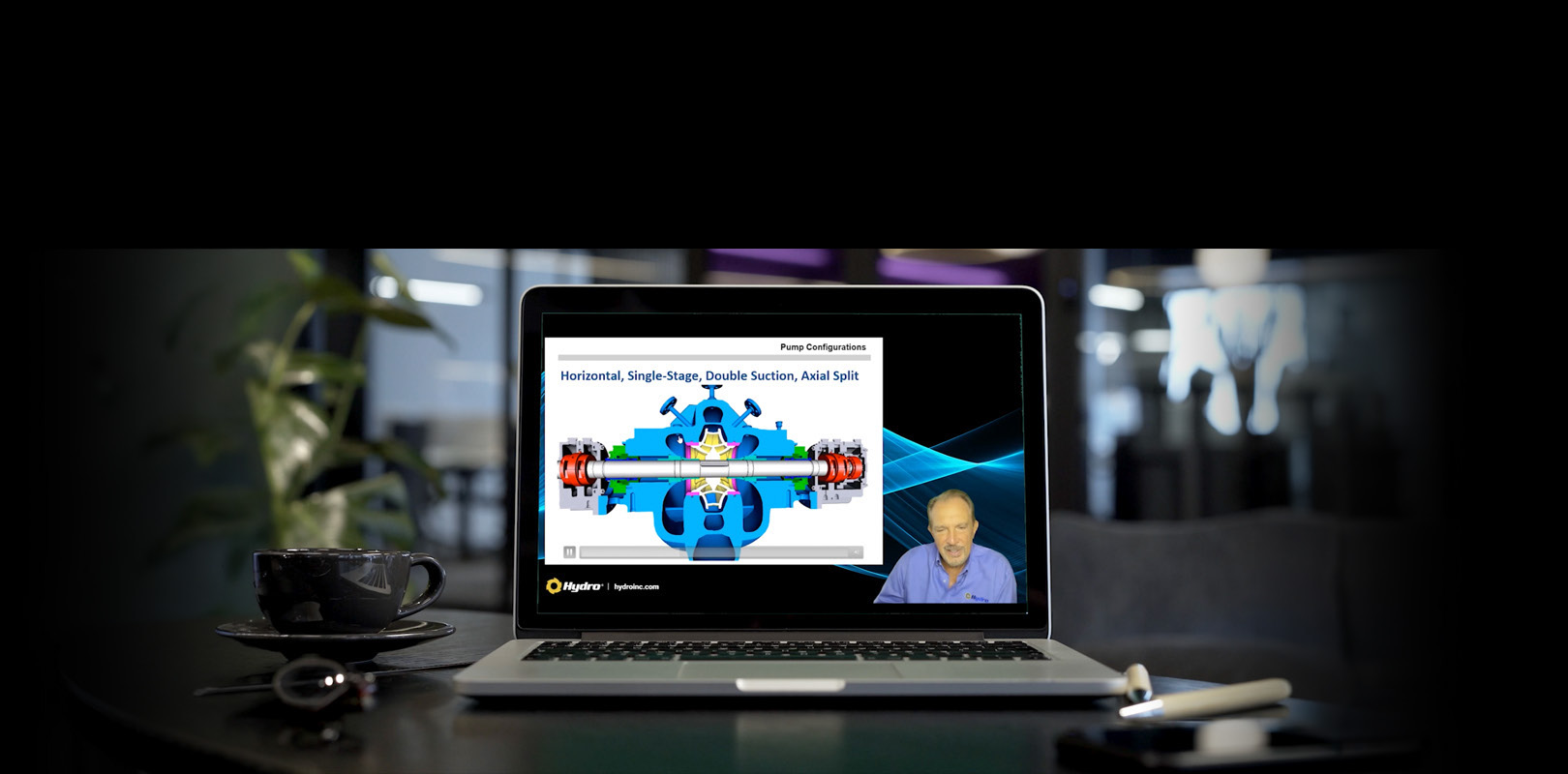 A Hydro University pump webinar playing on a laptop